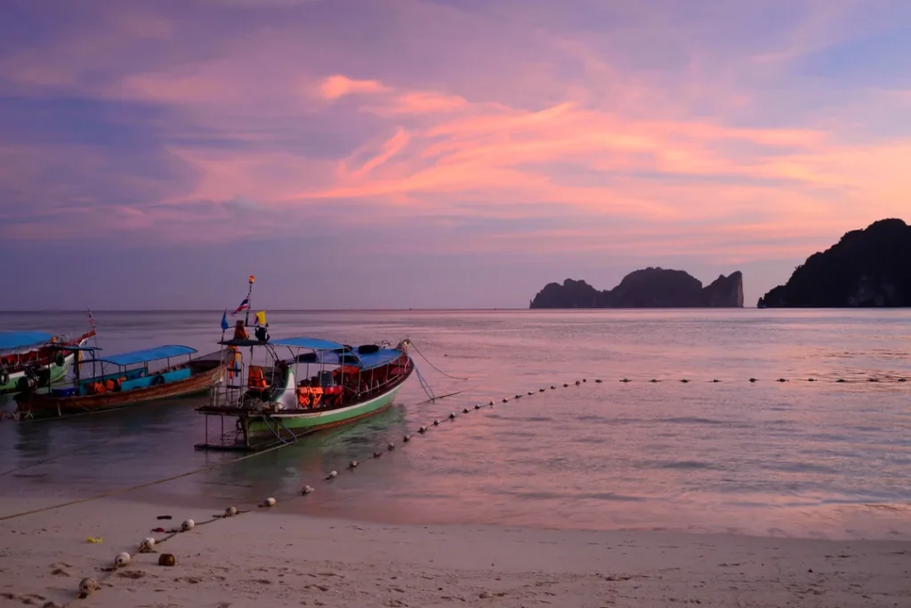 Tour boats moored at sunset on Koh Phi Phi Don